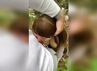 Her big naked tits, she sucks her guy in a forest